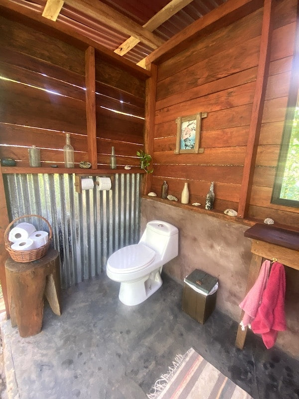 Indoor bathroom finished in local hardwood and zinc