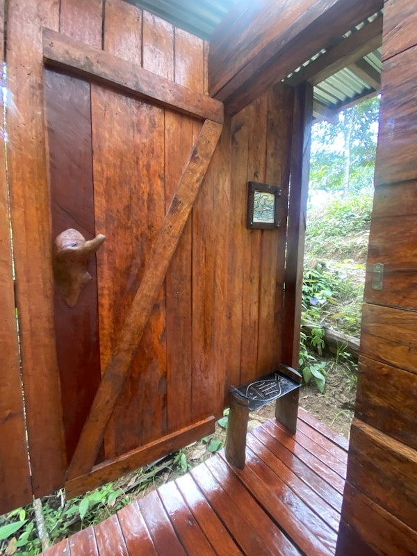 Hand-carved hardwood door of a tiny house