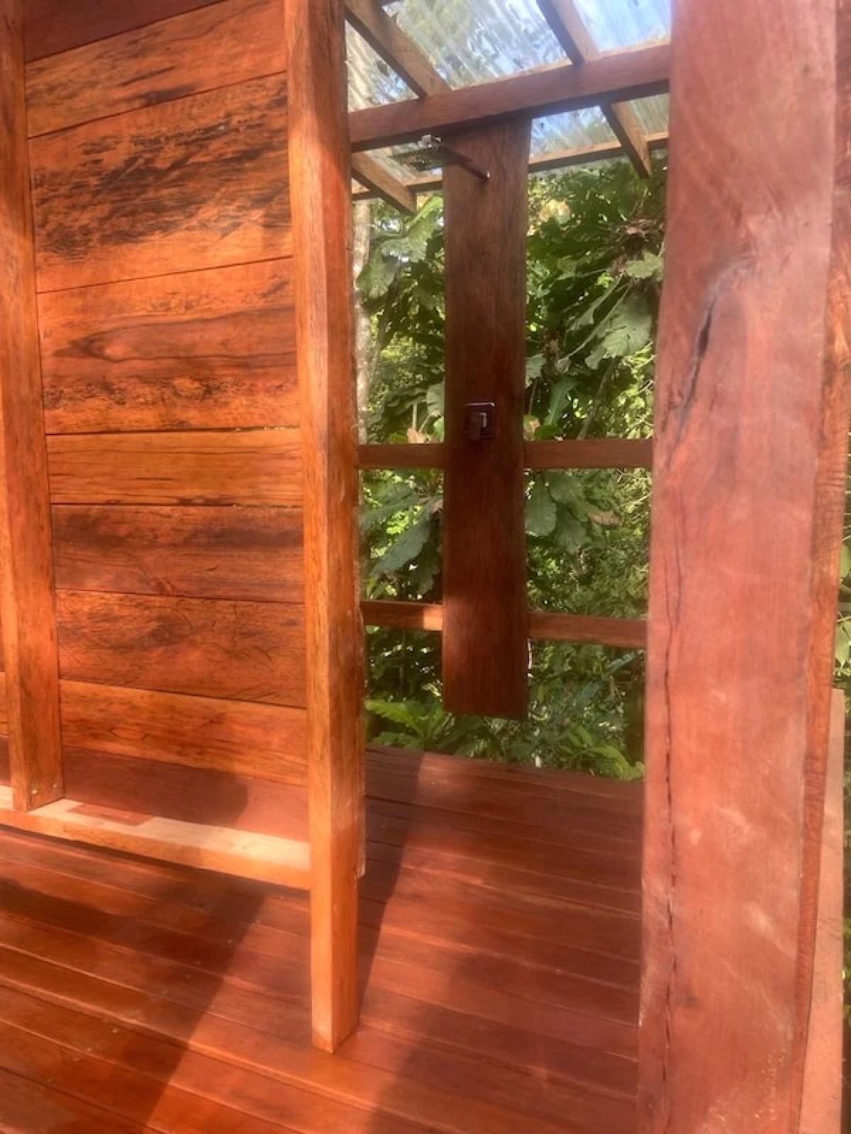 Polished hardwood door and deck of a tiny house