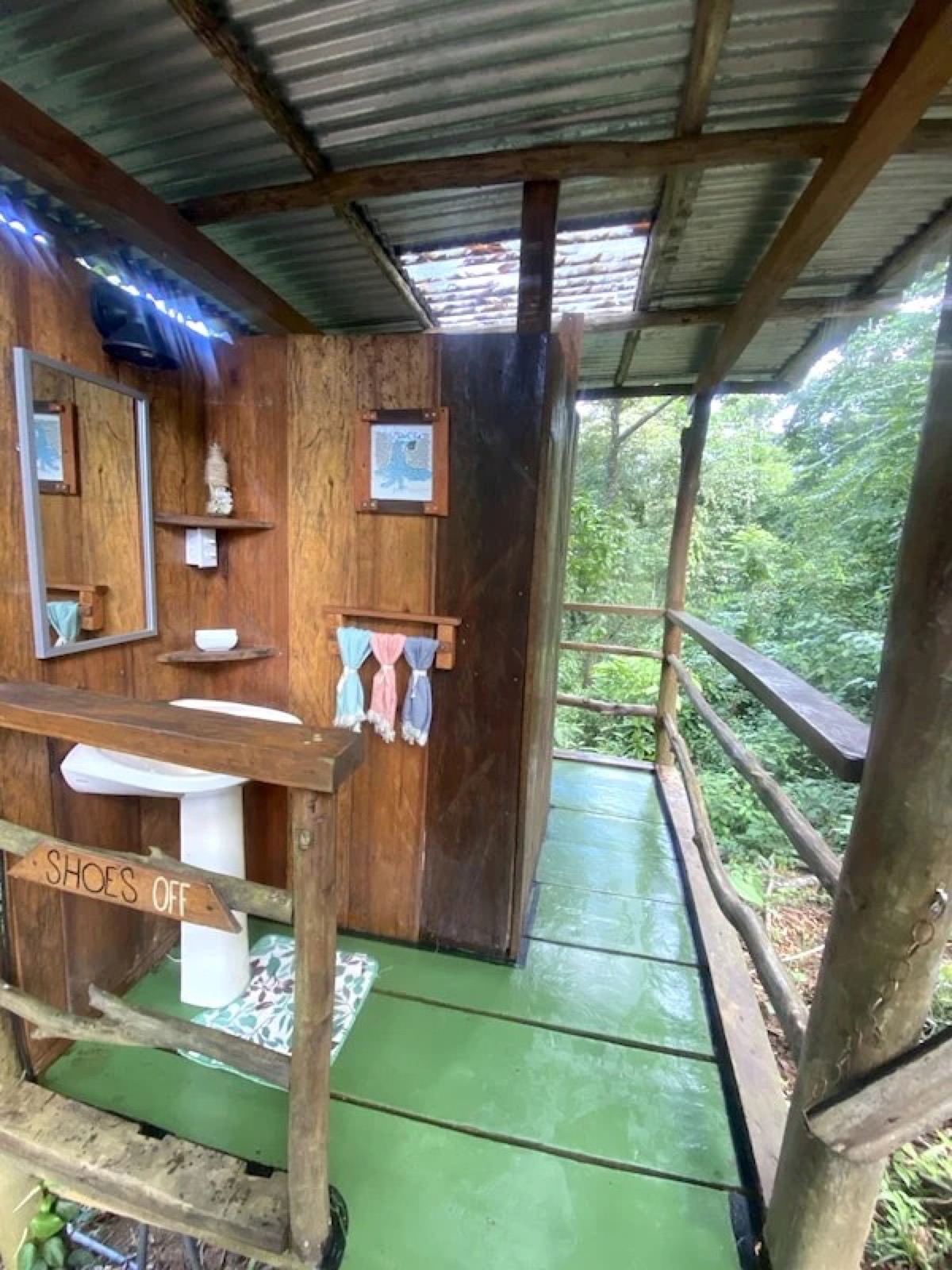 Elevated hardwood washroom with a sink and a jungle deck